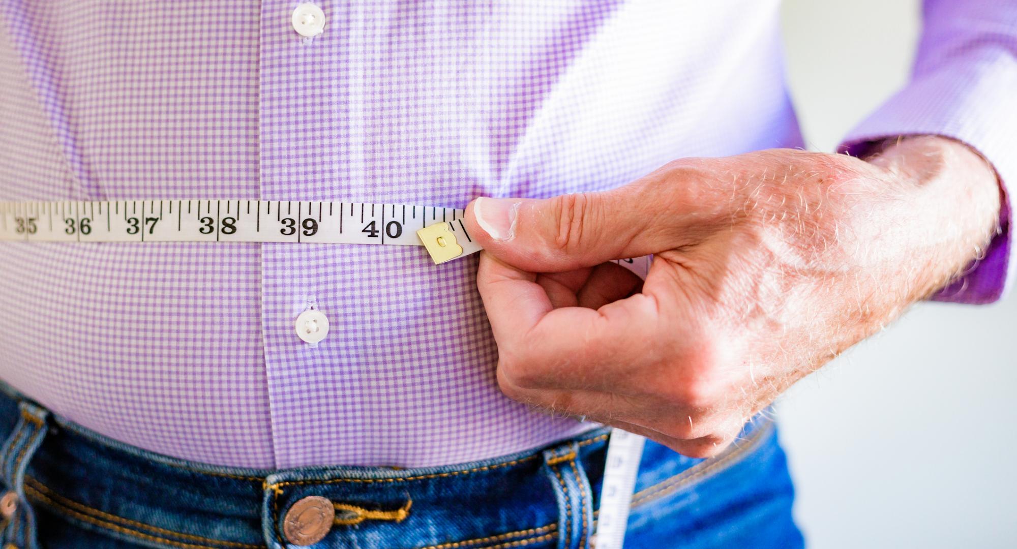 Man measuring his waist