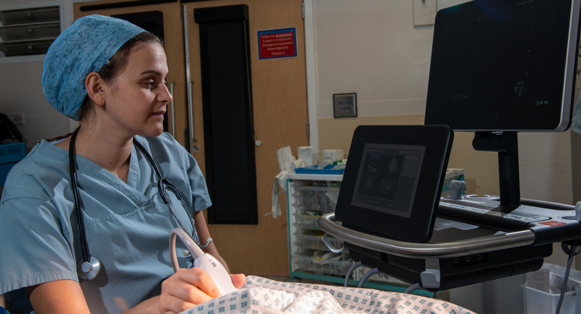 NHS worker scanning a patient