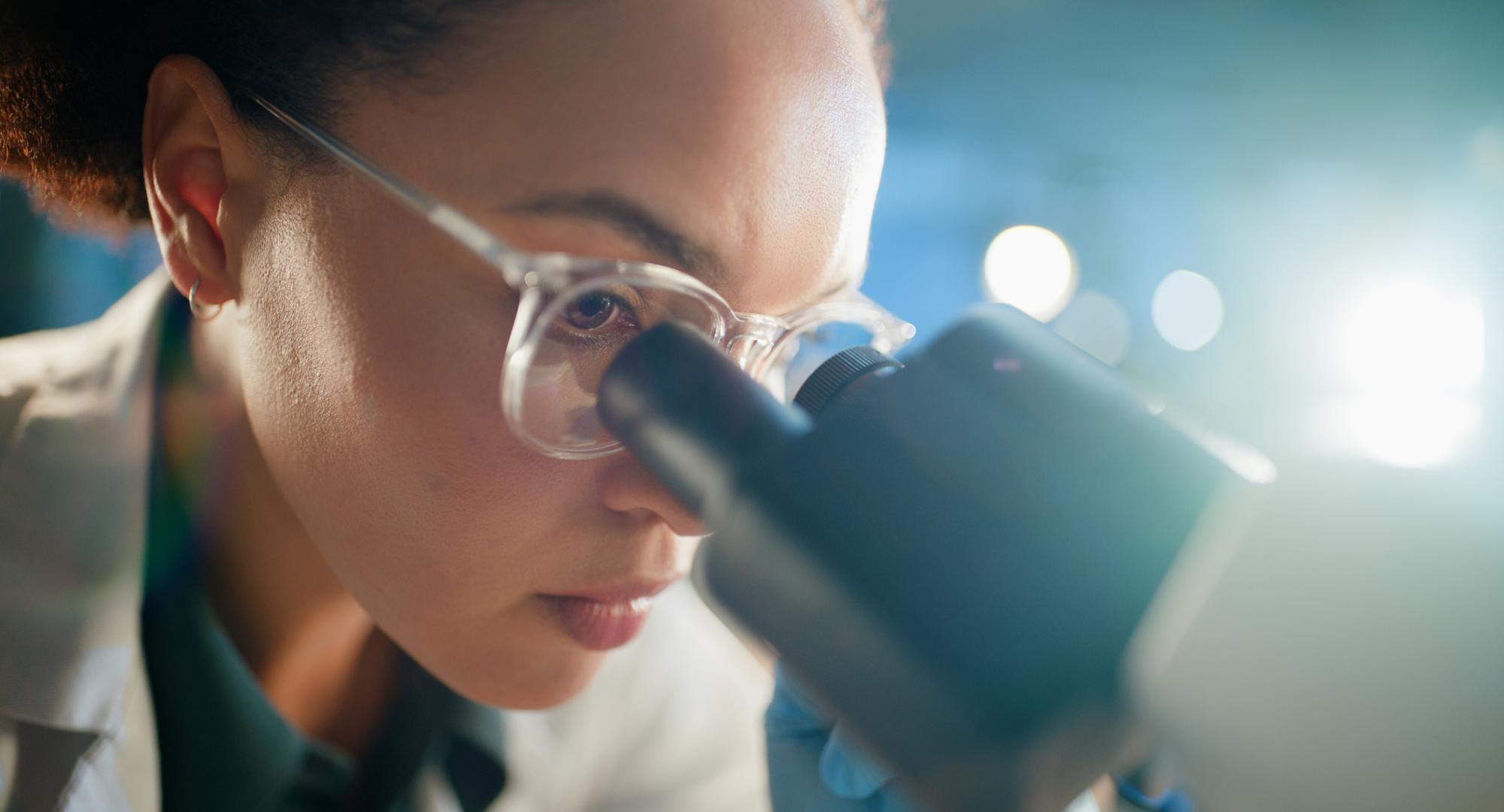 Women looking into a microscope