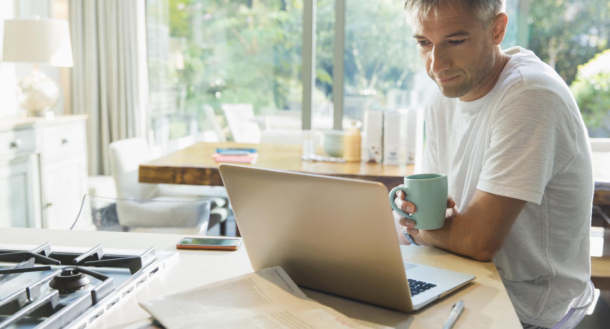 Man using a laptop at home