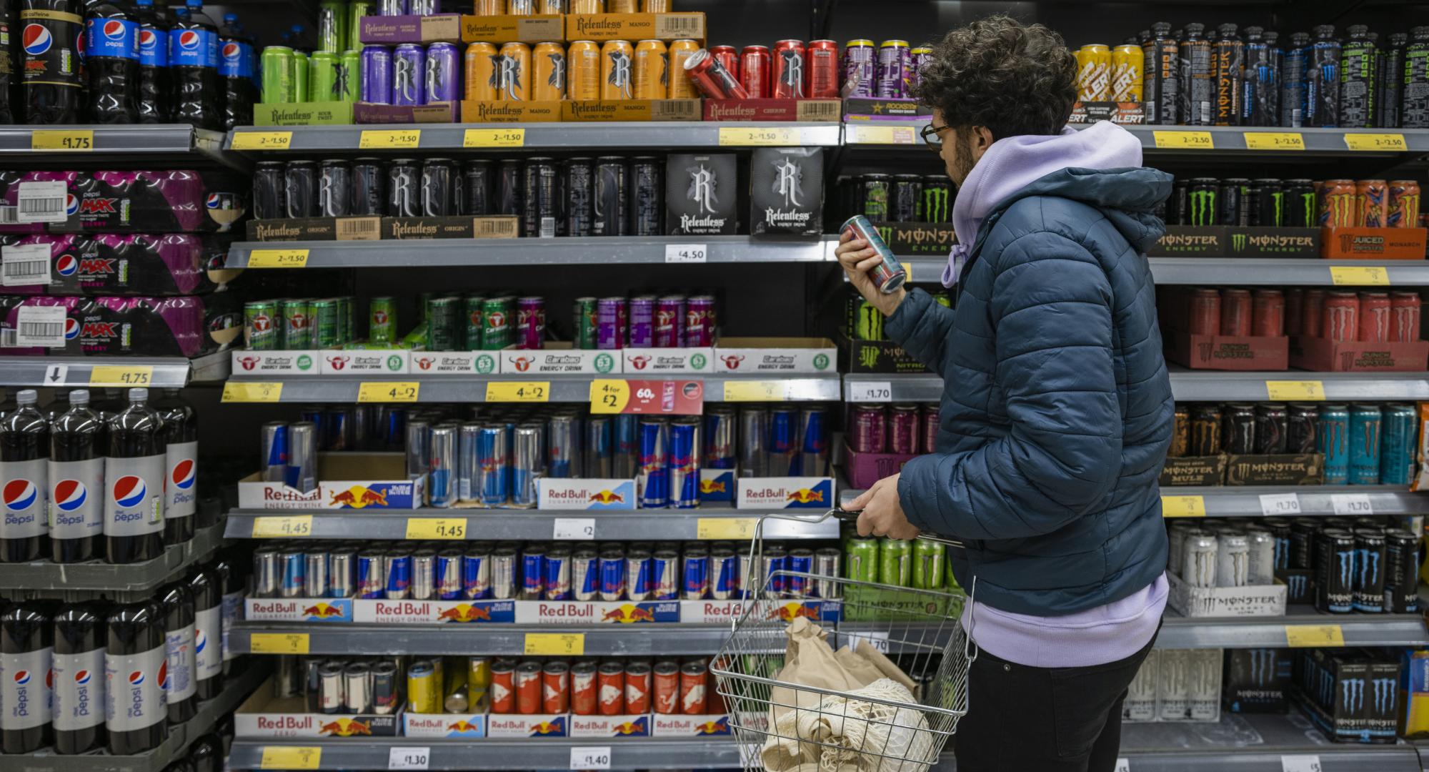 Person buying energy drink
