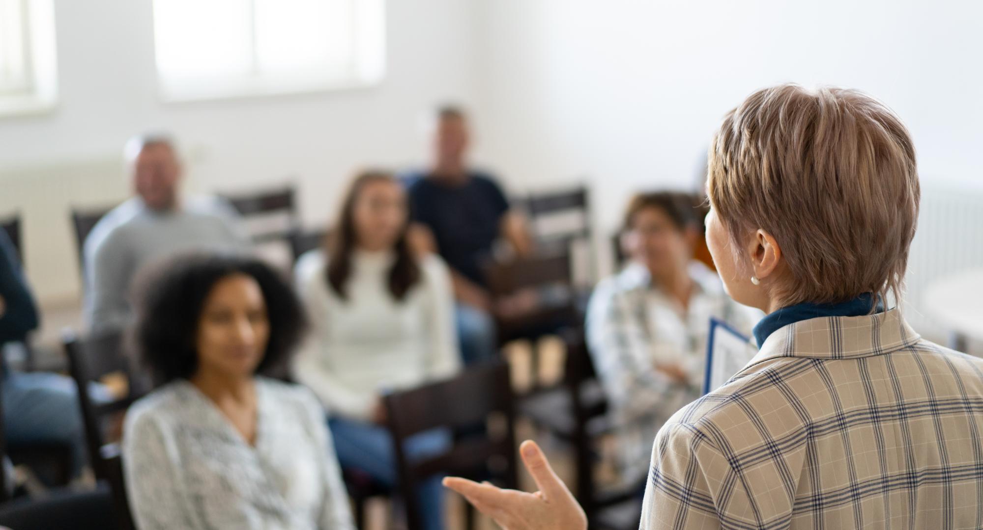 Someone delivering mental health training