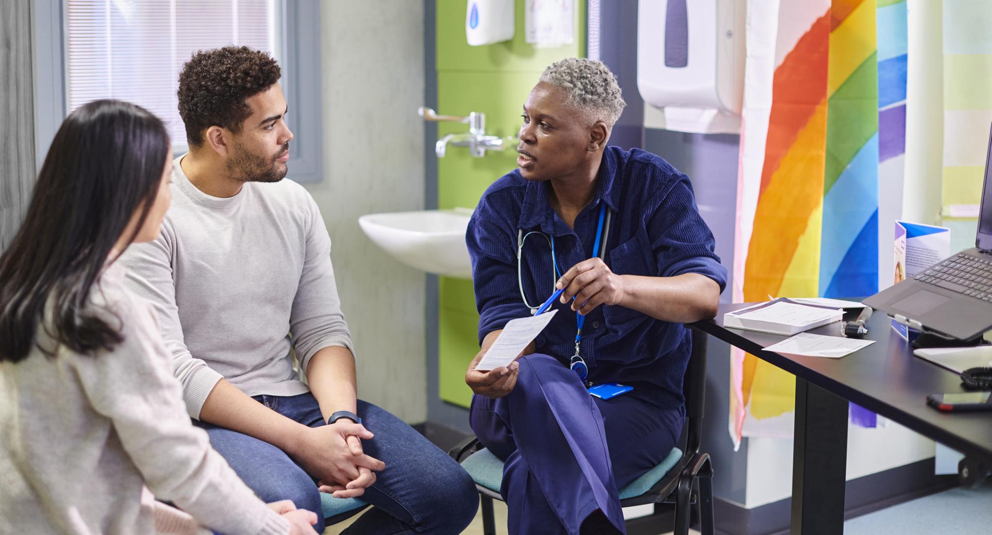 Doctor talking to a black male patient