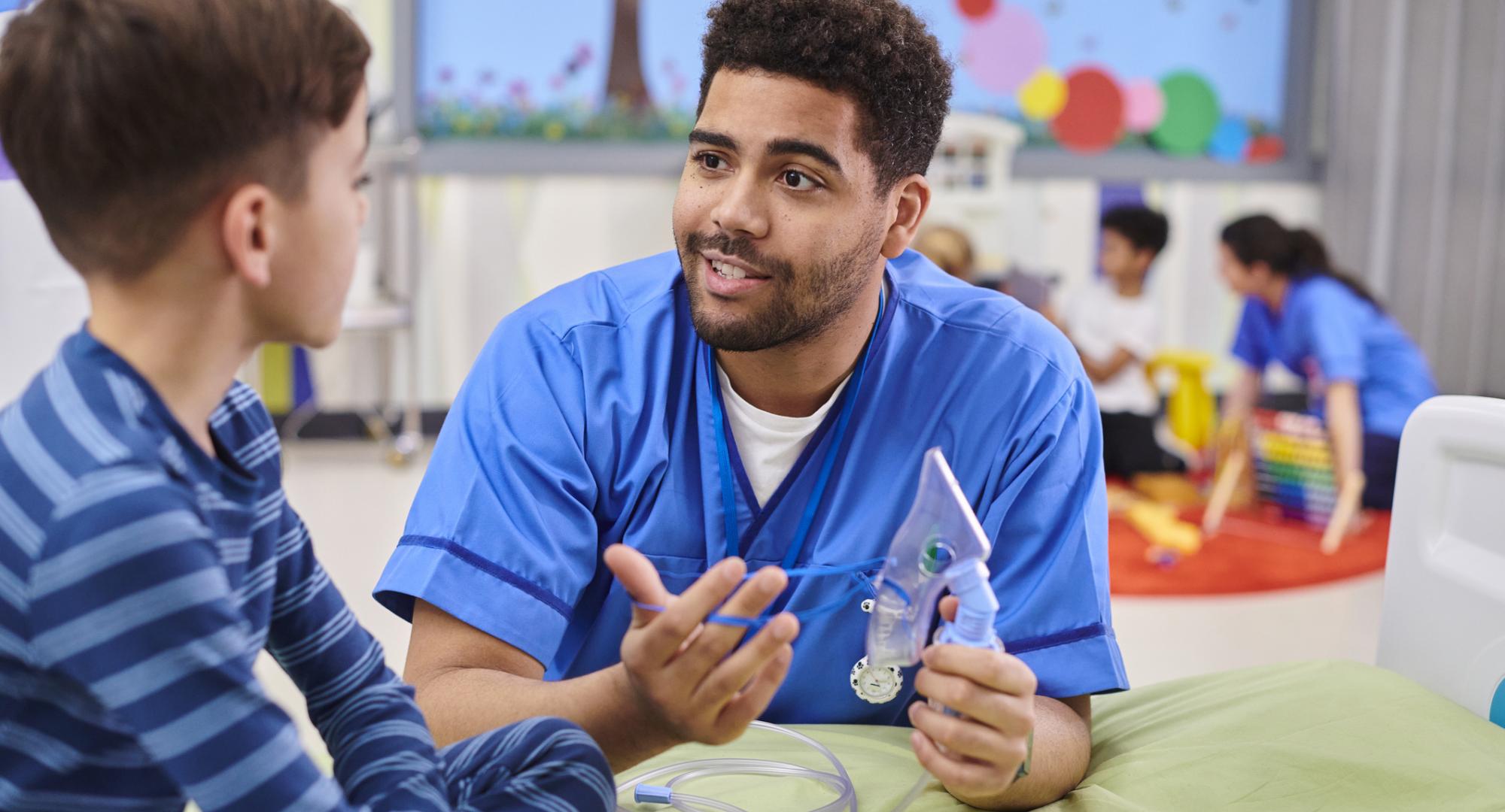 paediatric nurse talking to patient