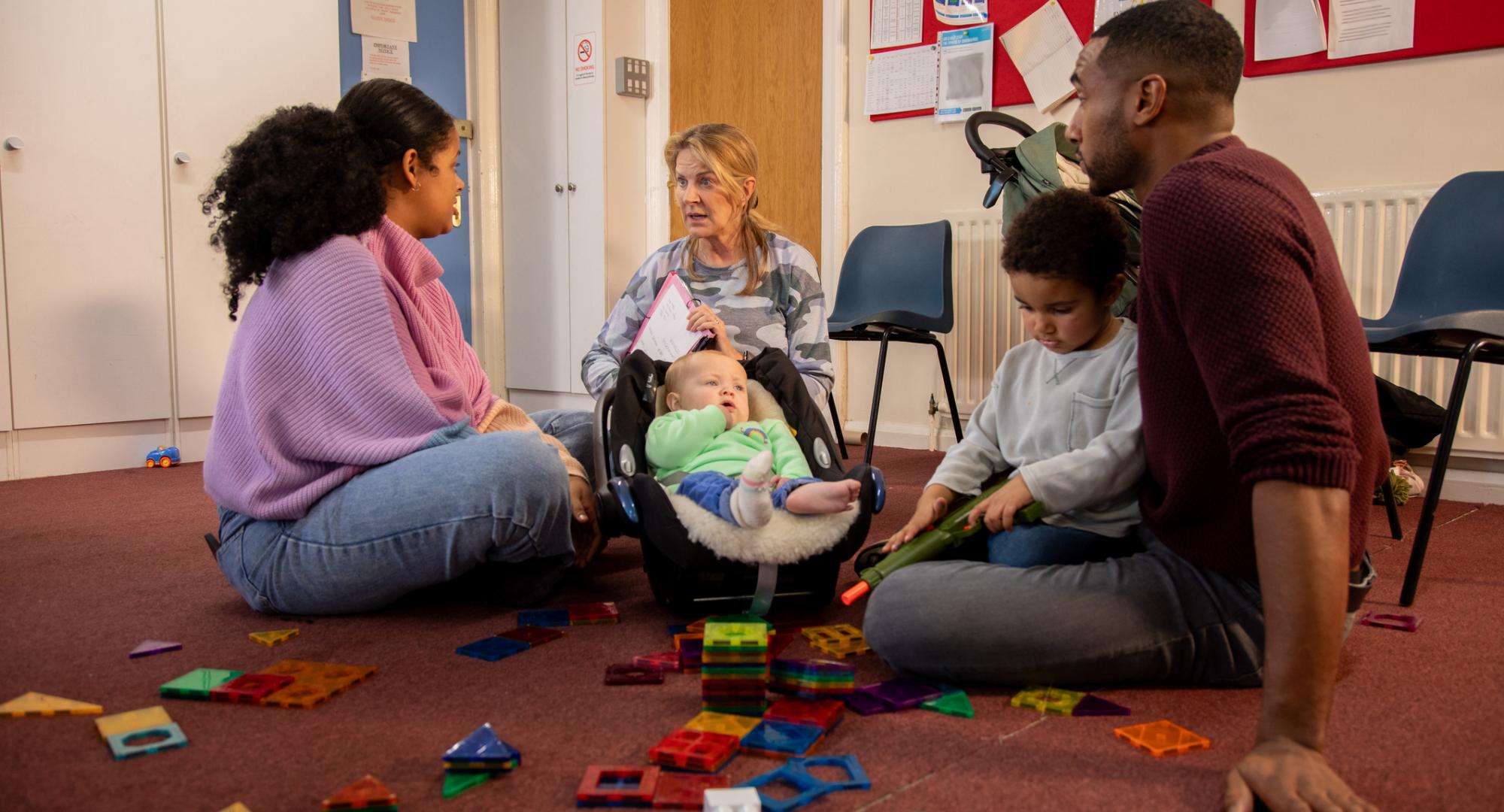 Family in a session with a childcare worker