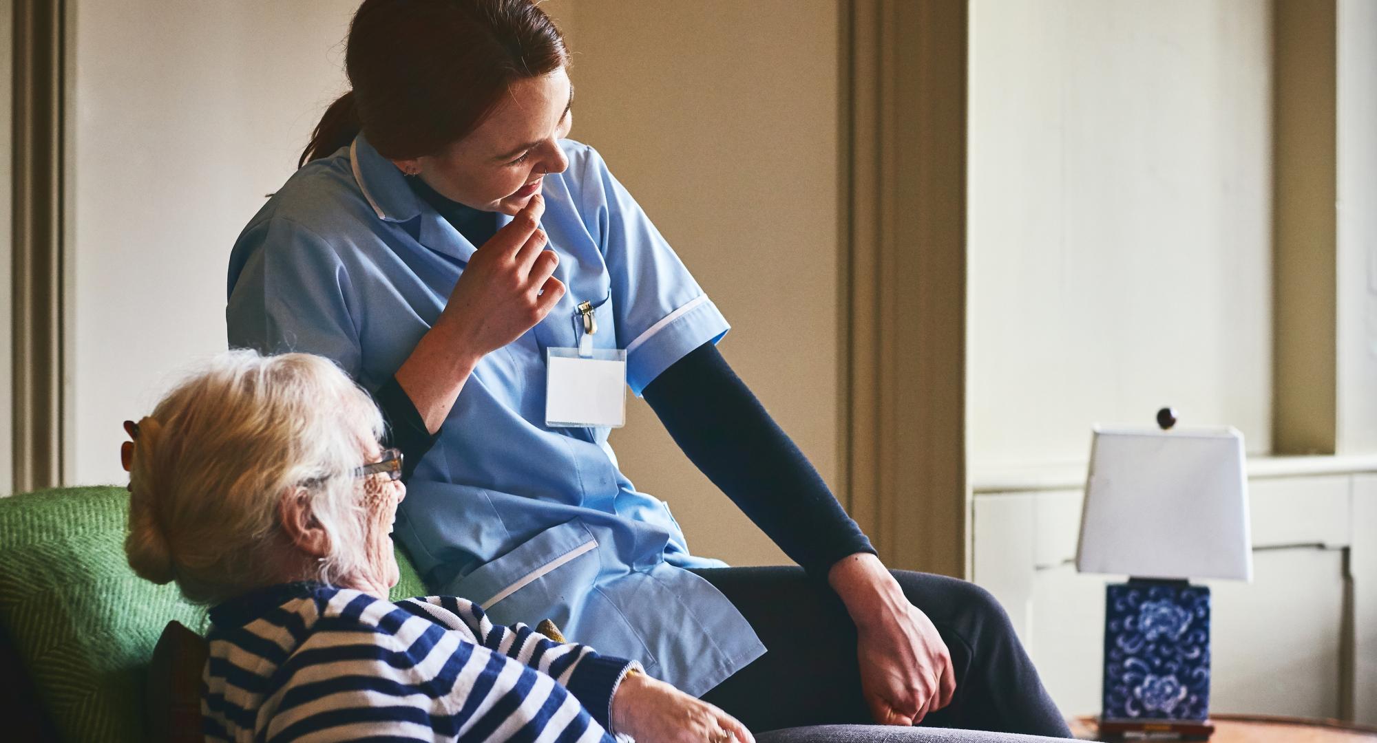 Social care worker with patient