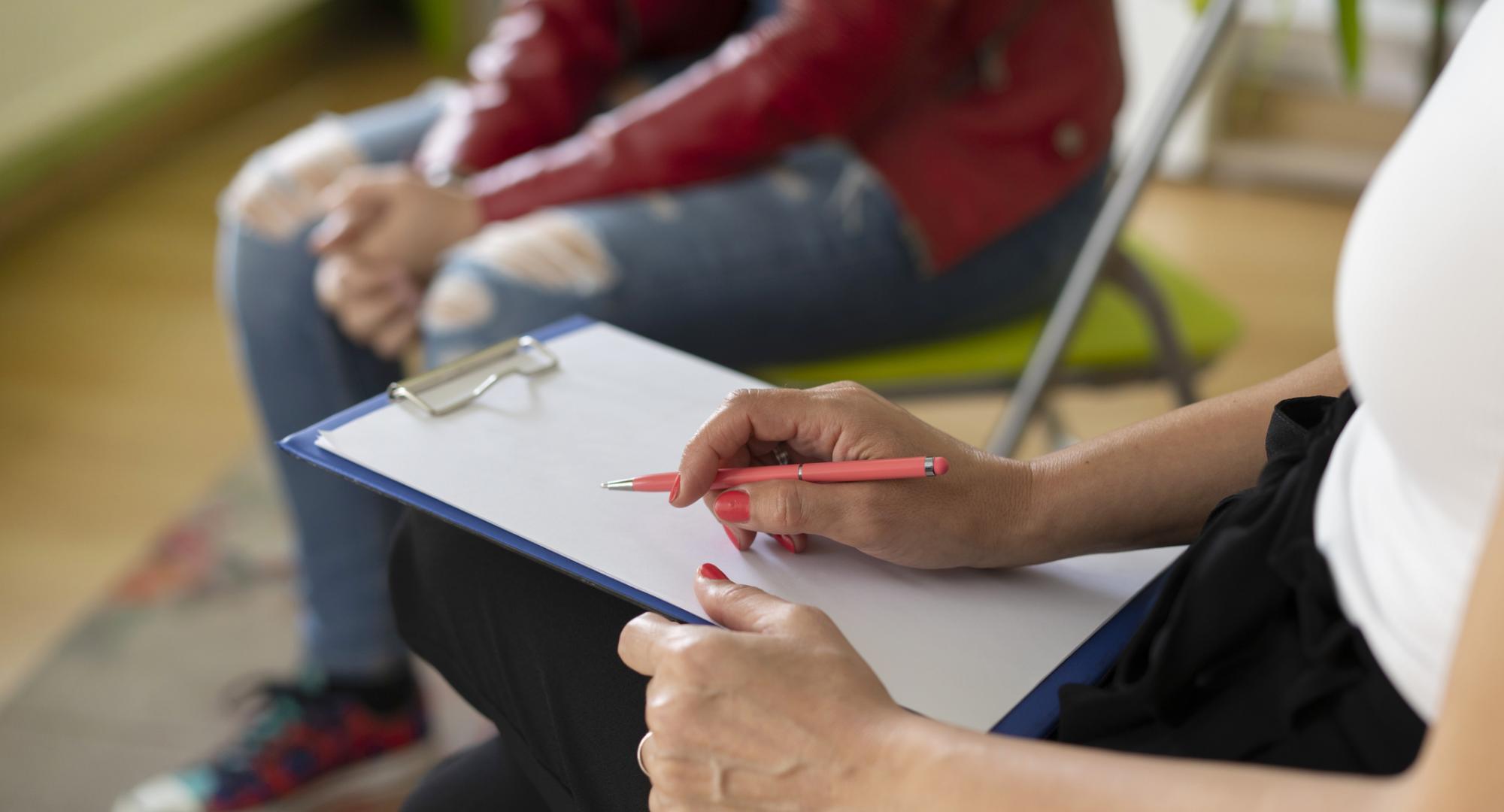 Psychologist meeting with young person