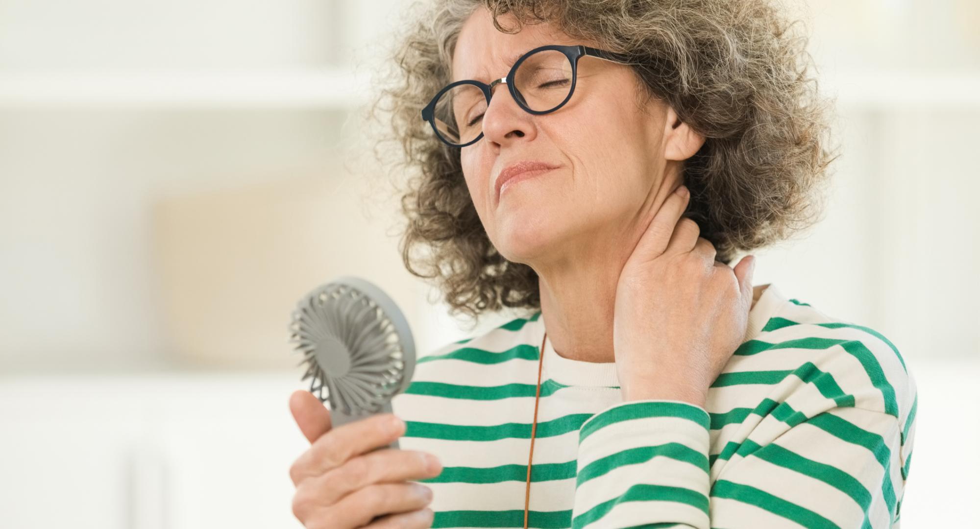 Menopausal woman having a hot flush
