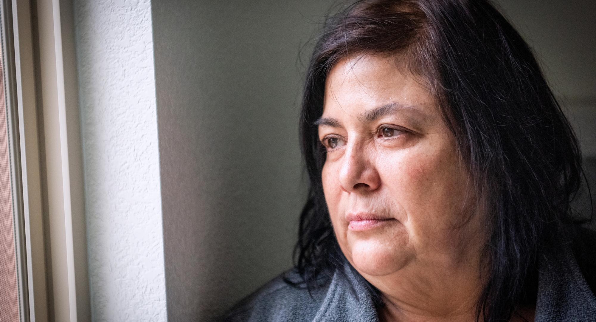 Woman looking out of window