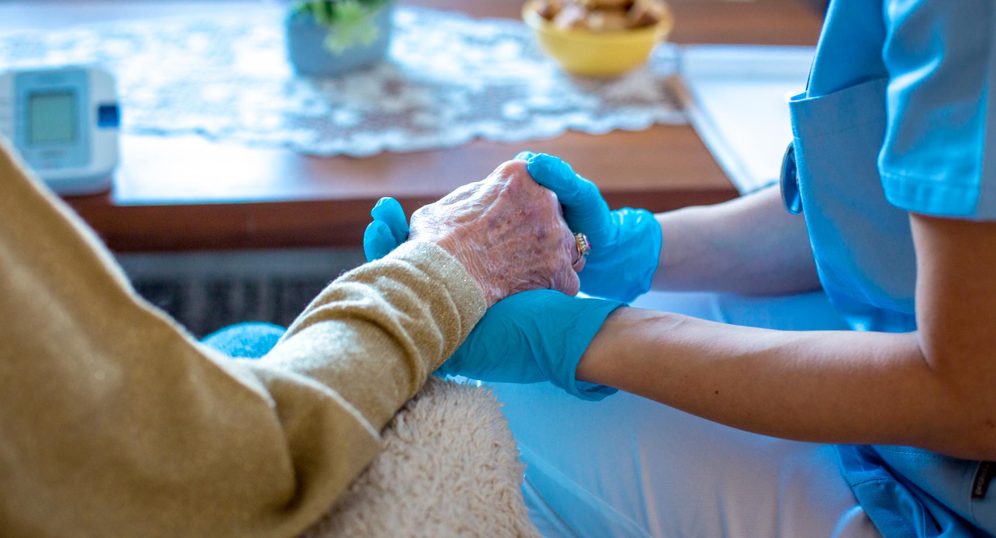 Social care worker with elderly patient
