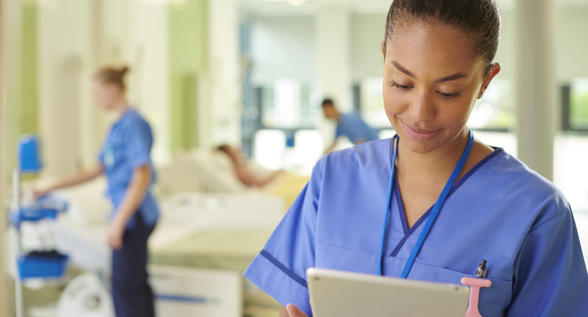 NHS nurse using iPad