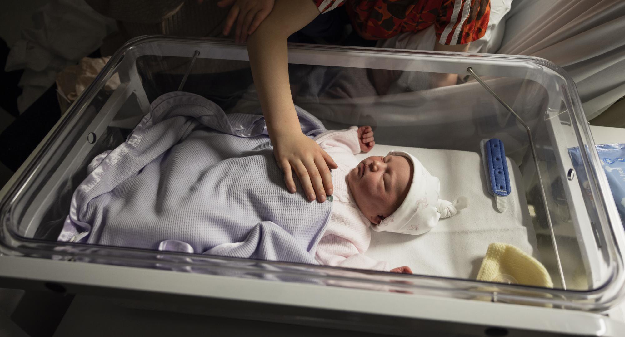 Newborn baby with family