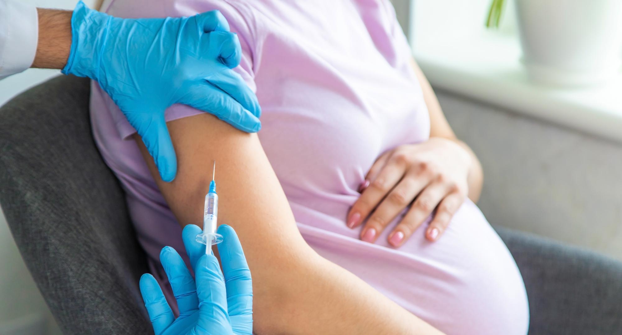 Pregnant woman being vaccinated
