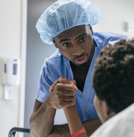 Male nurse attending to patient