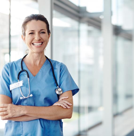 Female nurse stood in hallway [reversed]