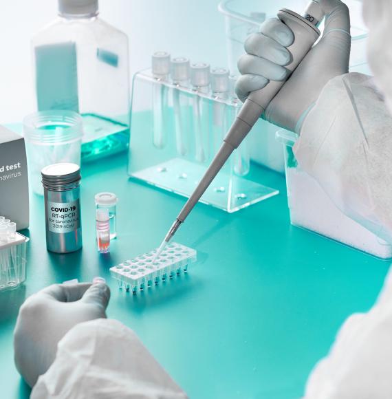 Lab technicians using pipette