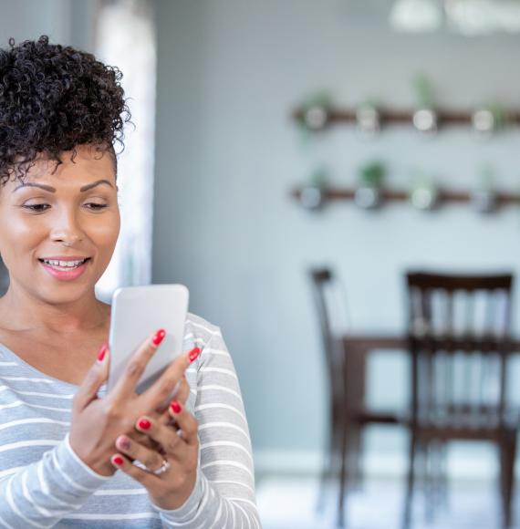 Young woman using her mobile phone