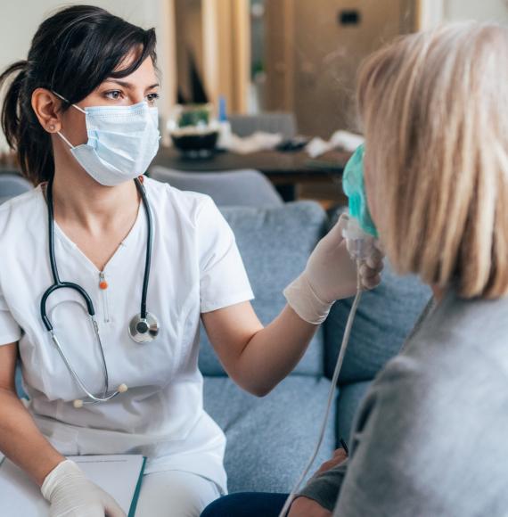 Health professional treating female patient