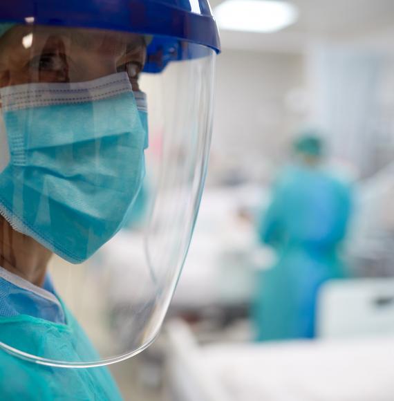 Health worker in PPE visor