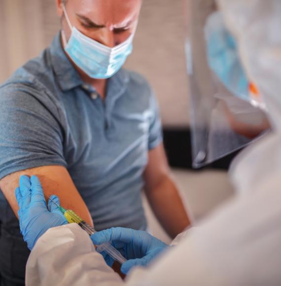 Male patient receiving a flu vaccination