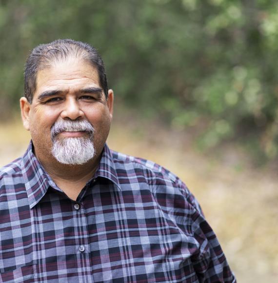 Overweight man smiling at the camera