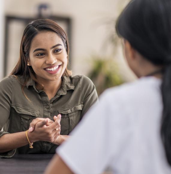 Woman having conversation with mental health professional