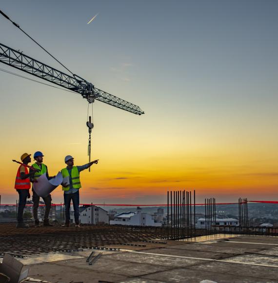 Construction workers stood atop a construction site