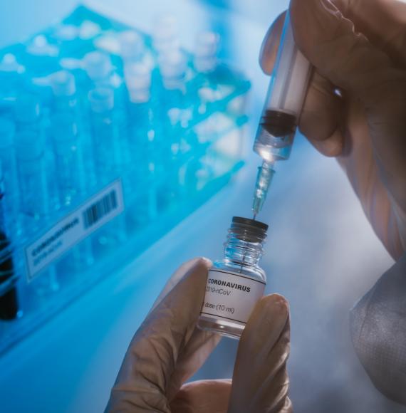 Vaccine bottle being filled