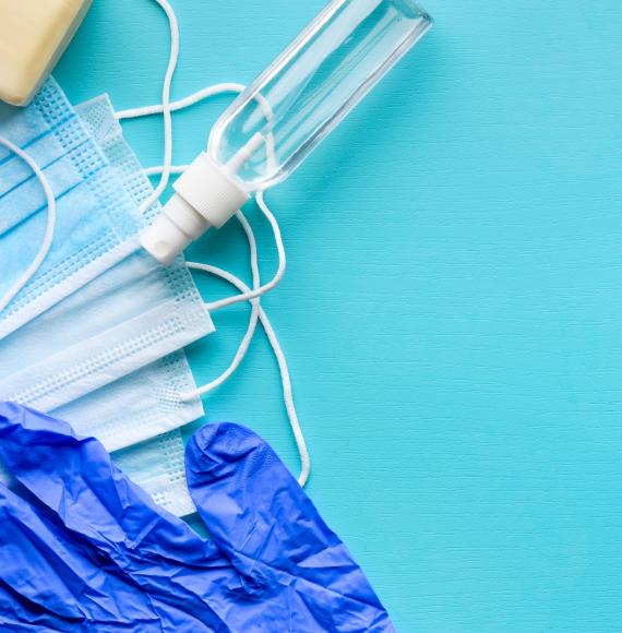 Assortment of PPE goods against a blue background