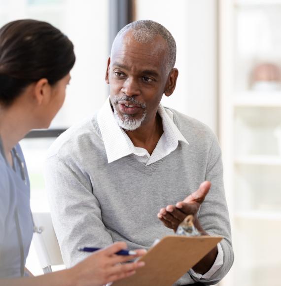 Patient in conversation with a health professional