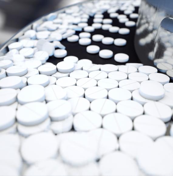 Medicine pills on a manufacturing conveyor belt