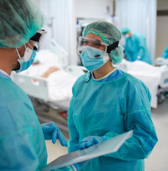 Medical professionals in discussion on a ward