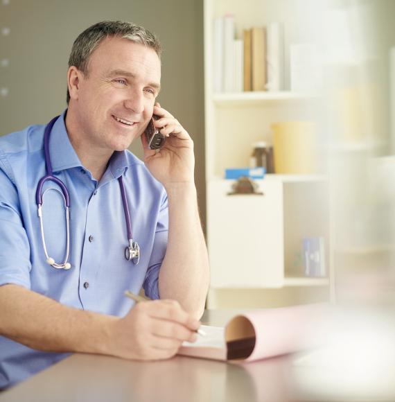 Male doctor on the phone