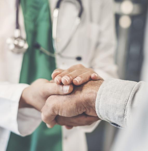 Health professional shaking hands with a patient