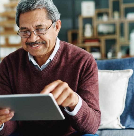 Older man using an iPad