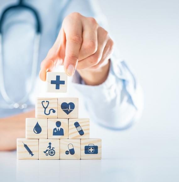 Illustration of the building blocks of health; health professional stacking objects