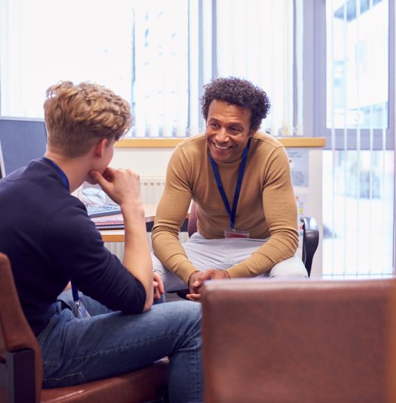 Counsellor talking with young male about his mental health