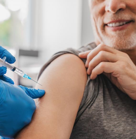 Man being administered a vaccine