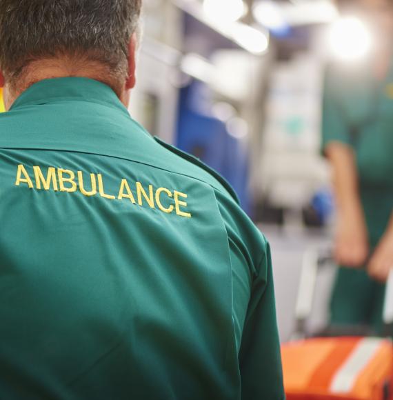 Back of a paramedic shirt emblazoned with the word ambulance