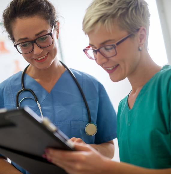 Student nurse discussing with her mentor