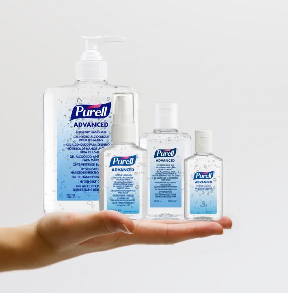 PURELL bottles being held up for display