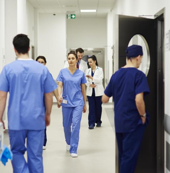 Health professionals in a busy hospital corridor