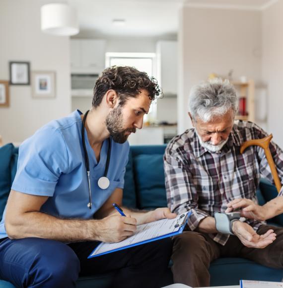 Social care worker talking to a patient