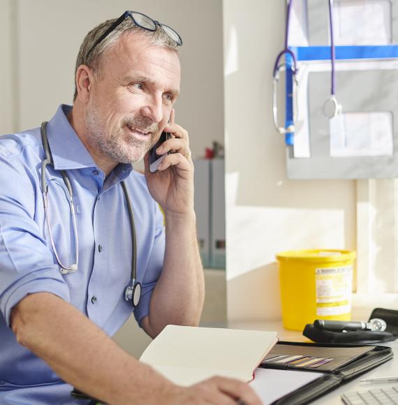 Consultant using the phone to speak with colleagues