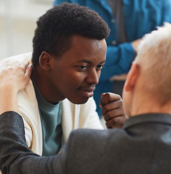 Young man talking with a health professional