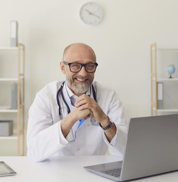 Doctor using a laptop to communicate with patients