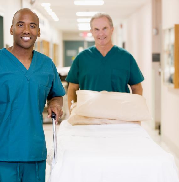 Two porters moving resources around the hospital