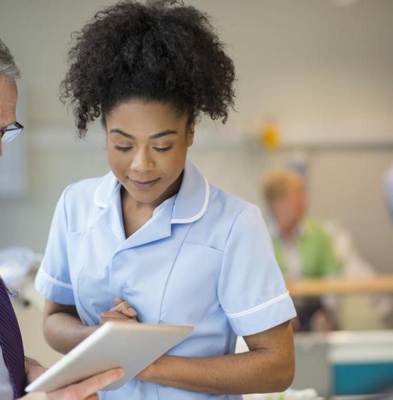 Nurse and a health administrator discussing information