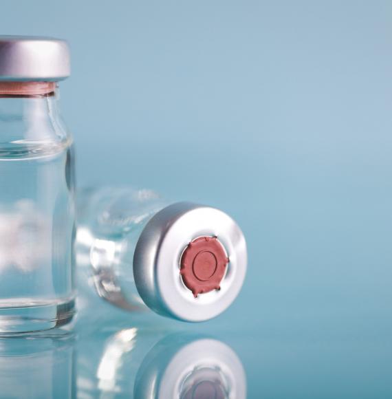 Vaccine vials against a generic background
