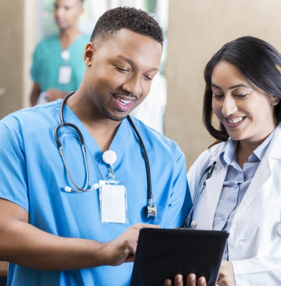 Medical professional discussing with his colleague